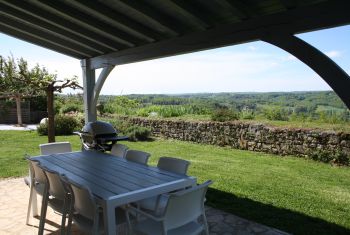 The covered terrace with fantastic view!