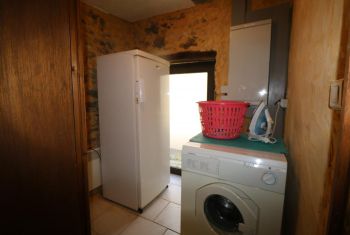 the second laundry and extra fridge/freezer at kitchen level