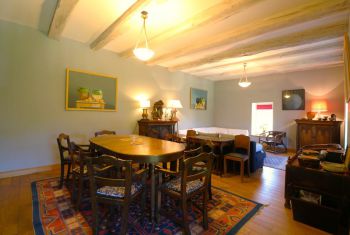 The Dining Area has an antique wooden dining table that can seat 8 people 