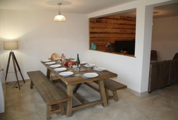 The dining area opening onto the kitchen