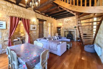 The dining area, with lounge and woodburner