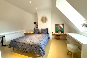 The large master bedroom bathed in light 